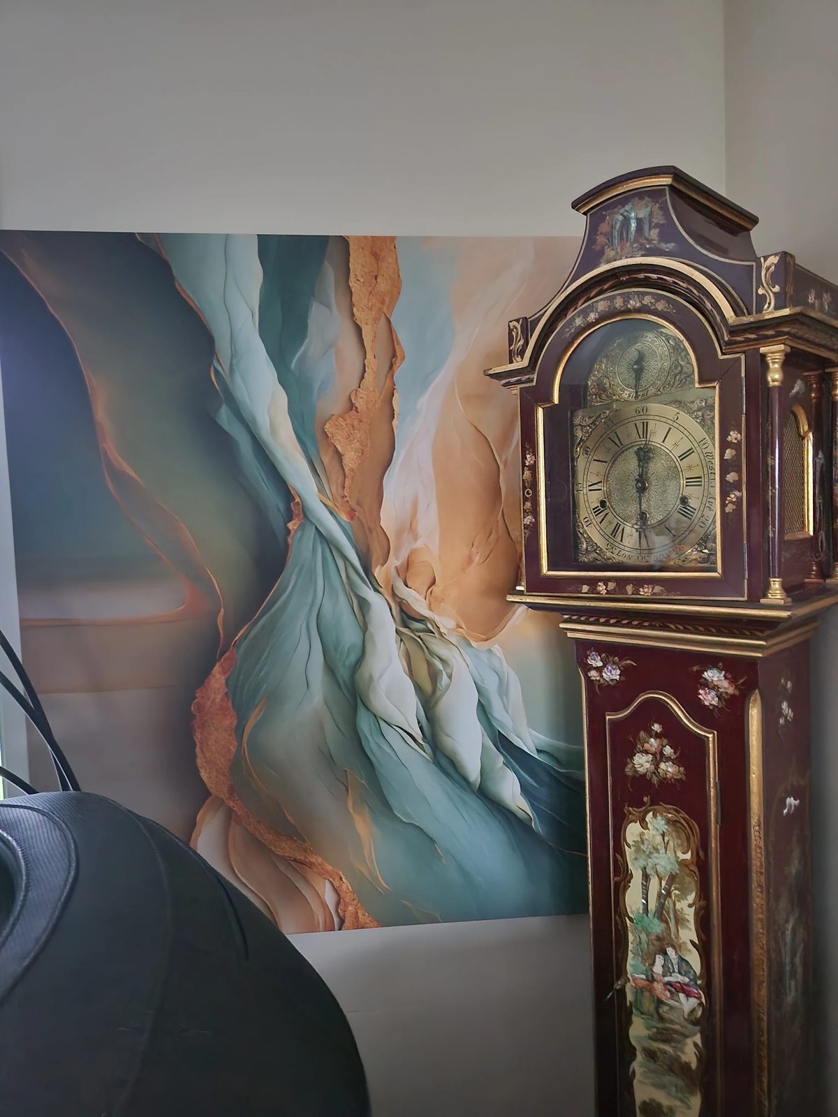 Customer photo — canvas artwork beside an antique grandfather clock