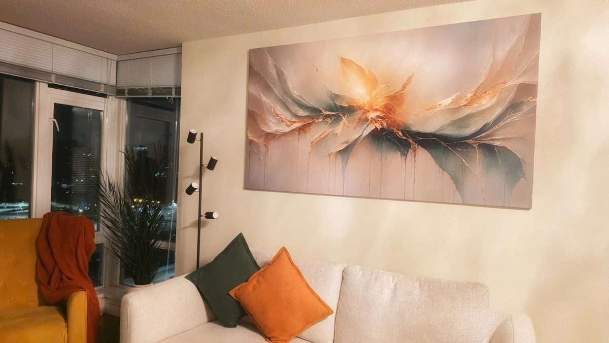 Customer photo — canvas artwork hung above a living room sofa